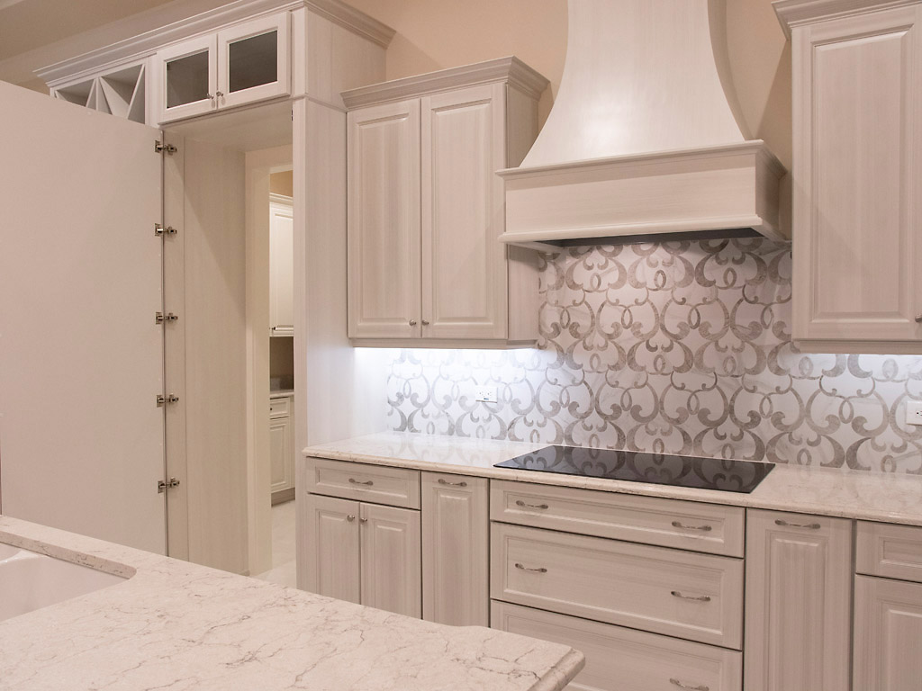 Custom Built Home 5292 Square Feet - Custom built faux cabinetry is a doorway into the pantry.
