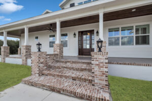 Brick Steps Leading Up The Raise Covered Porch