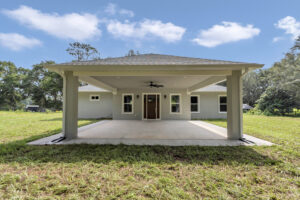 A view of the home's front entry and unique covered porte-cochère