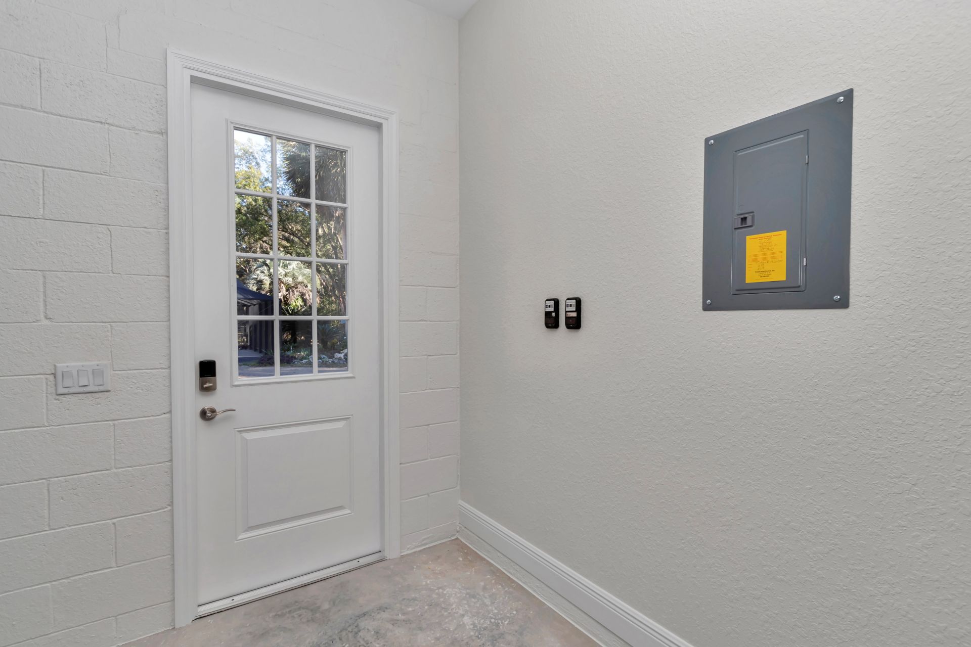 Interior shot of the entry door highlighting the natural light in the foyer.