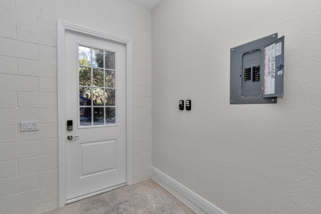 Close-up of the electrical sub-panel in the entryway for easy access to building power.