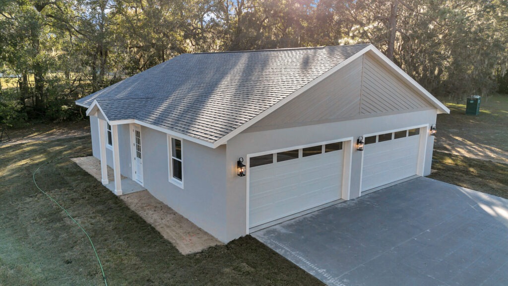Full view of the building exterior showcasing the distinct garage and office wings