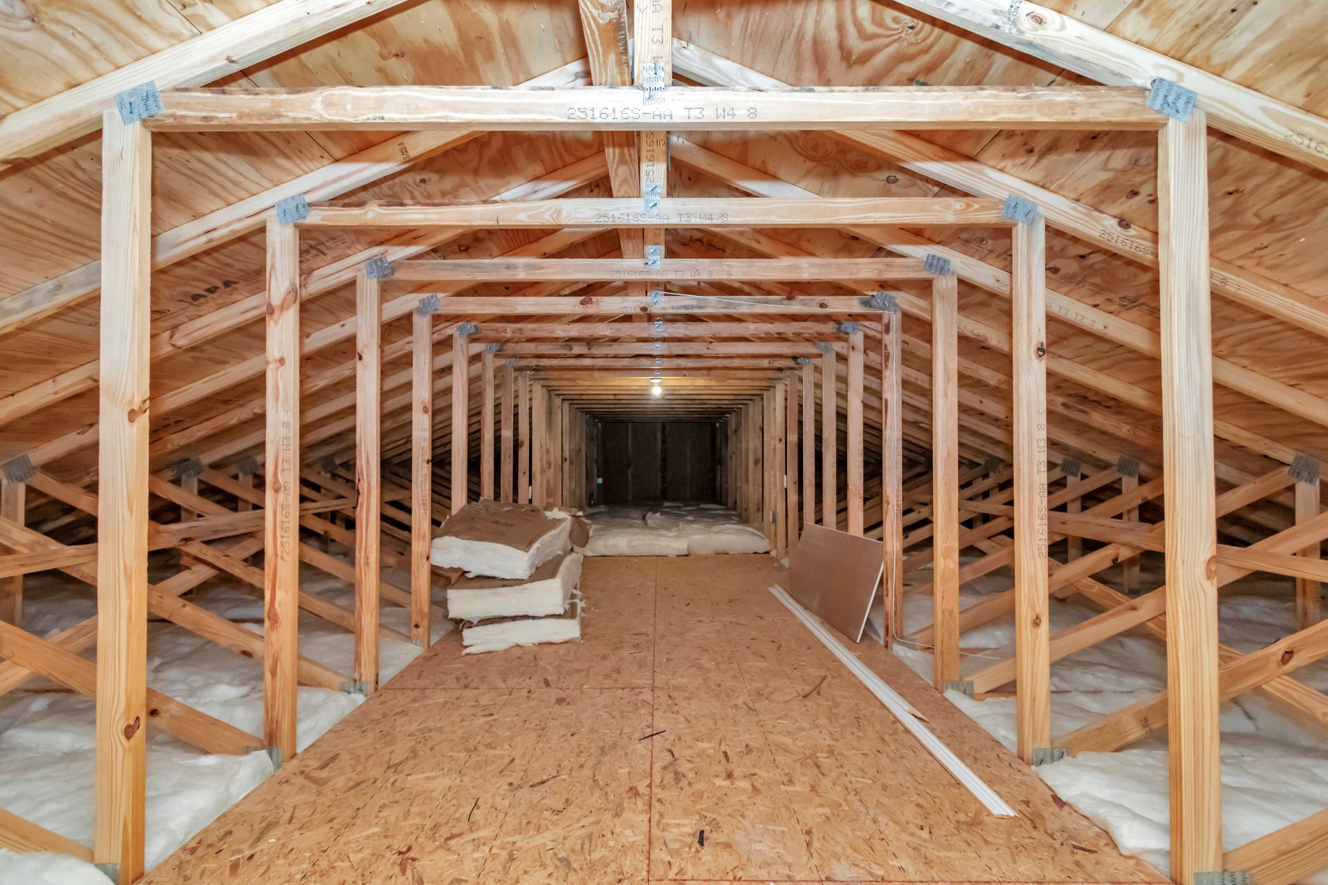 Spacious attic storage area with potential for future room conversion.