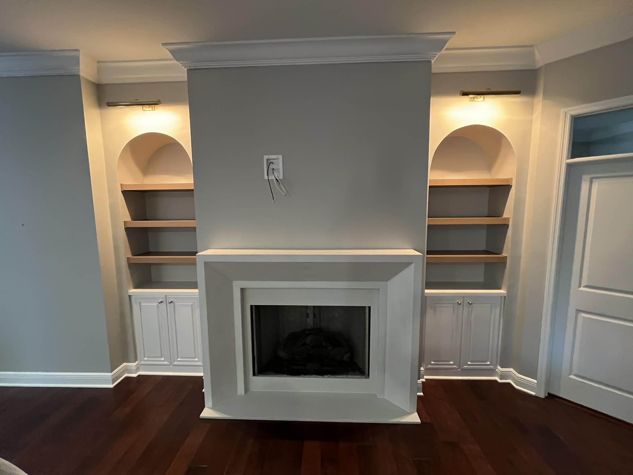 To ensure the new fireplace felt like a permanent part of the home, we used a refined color palette specifically matched to the existing walls.