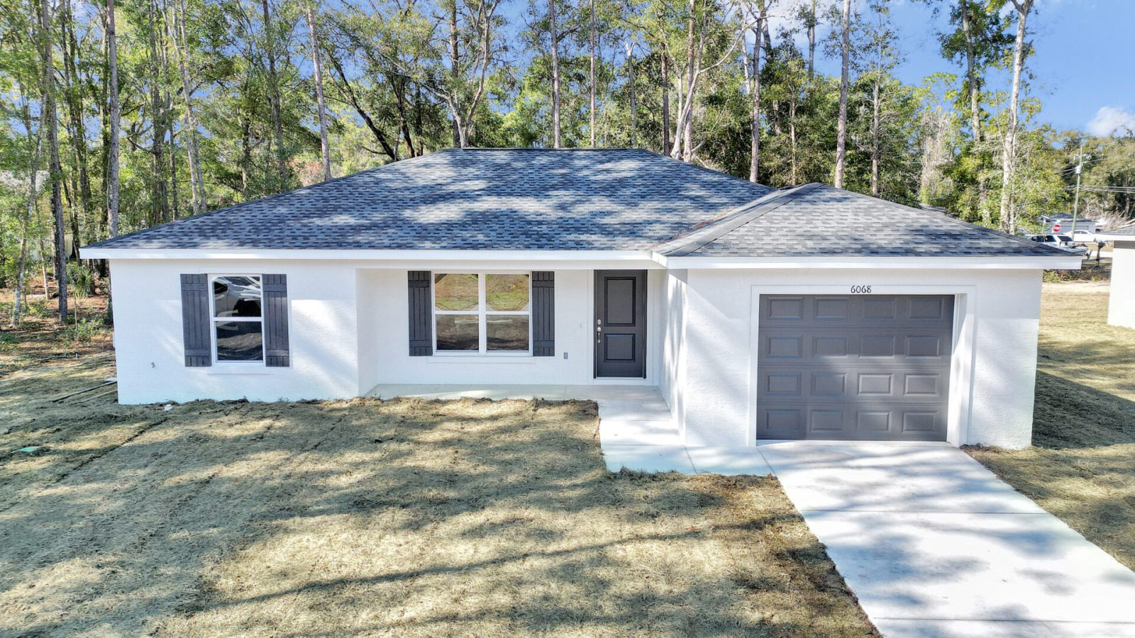 1280 Model - View of the home at the top of the driveay