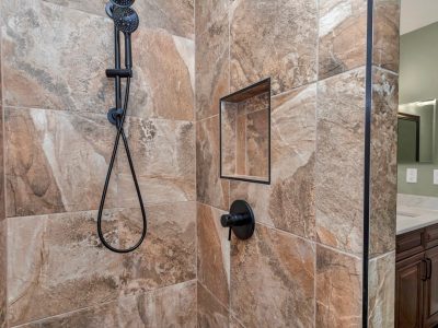 Close-up of premium tiling and modern fixtures in the guest bathroom