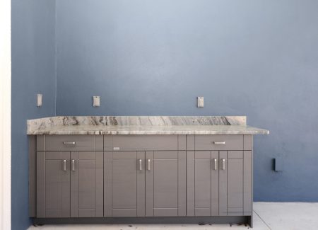 Large covered lanai with pre-installed cabinetry for a future summer kitchen, perfect for entertaining with help from your custom home builder in Ocala, FL.