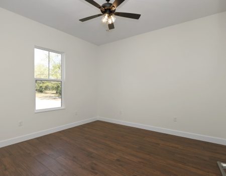 Interior perspective of the fourth bedroom, emphasizing the high ceilings and natural light in a JBC custom build.