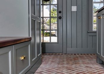 after - laundry room brick flooring