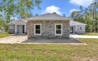garage window view of the French Residence, a versatile custom home built by Ocala home builders.